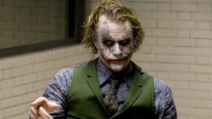 The Joker, as portrayed by Heath Ledge in "The Dark Knight" (2008) lectures Batman in the interrogation room. He looks like a clown pulled out of a dumpster.