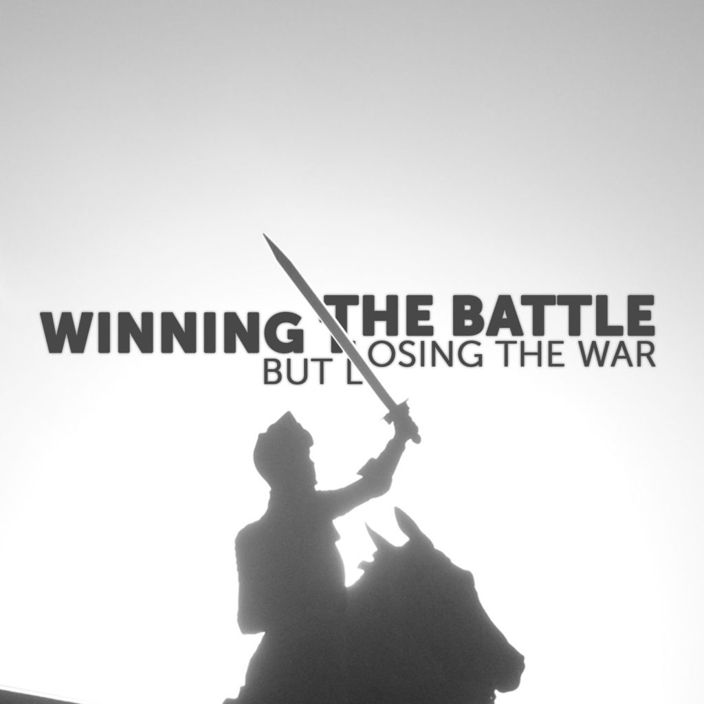 Text: "Winning the battle but losing the war" A mountain knight cuts the words in half