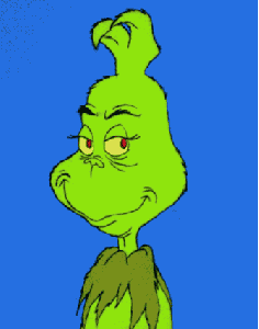 A screenshot of Dr. Seuss's Grinch, who curls his face with an evil smile as he thinks of a nasty idea.