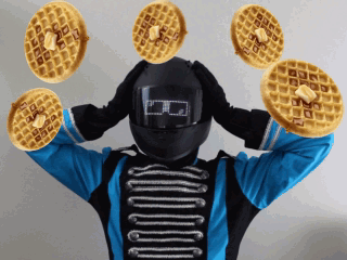 BroBot holds his head with scrambled eyes, and buttered waffles float in the air nearby.