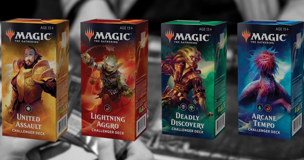 A photo of four different Magic: the Gathering deck boxes. They have different colors and names.